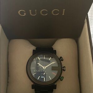 Gucci Black Watch with Green Crown and Subtle Red Accent eye catcher